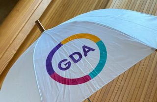 GDA logo on a white umbrella