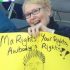 Member holds up a sign which says ma rights, your rights awbody's rights!!