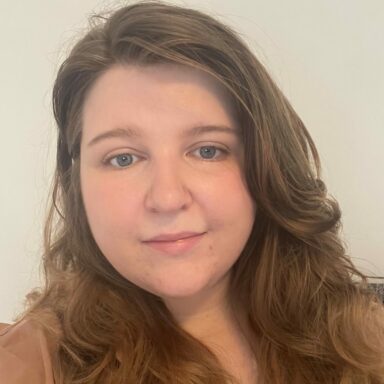 Close-up of Shannon's face. She has long brown hair and is looking at the camera.